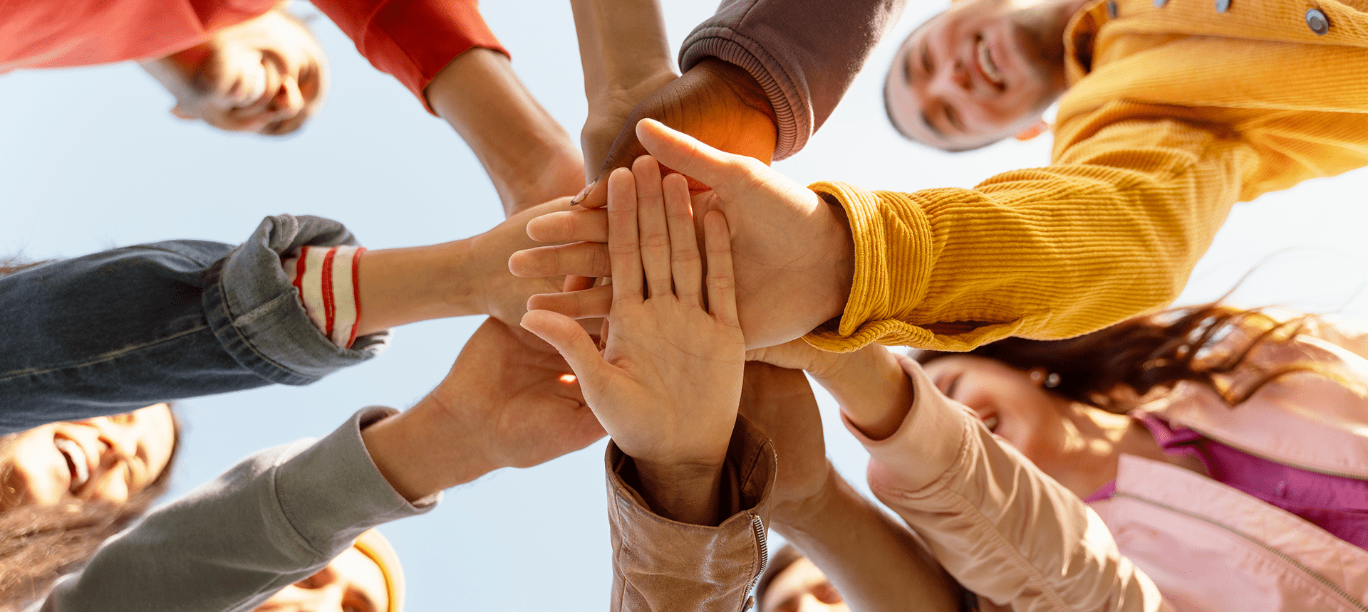 People connecting hands in a circle